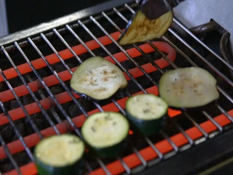 Zucchini fried on the grill, slow motion Video stock 76046410