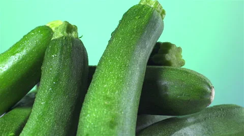 Zucchini isolated rotating on green background Stock Footage 62392038