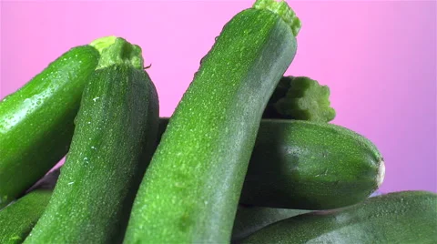 Zucchini isolated rotating on pink background Stock Footage 62391722