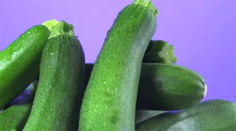Zucchini isolated rotating on purple background Video stock 62392166