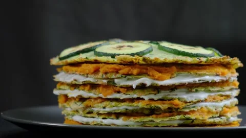 Zucchini Pancake Stack with Cream on Dark Plate at Cooking Studio Video stock 341428846