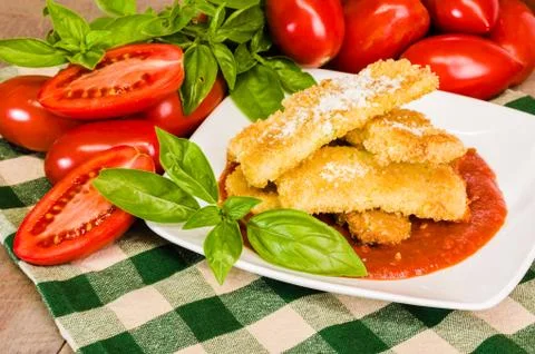 Zucchini parmesan dinner with basil Stock Photos
