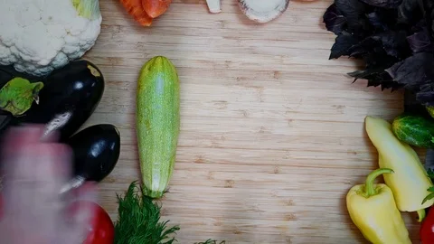 Zucchini rolls over the board Stock Footage 78055442
