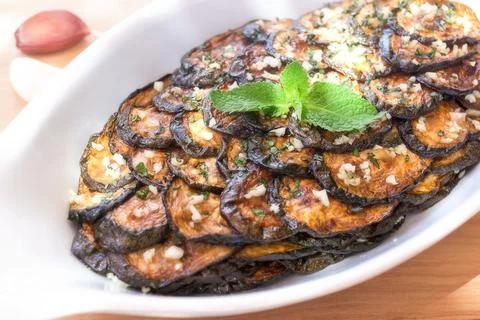 Zucchini scapece. Fried zucchini flavored vinegar and mint. Stock Photos
