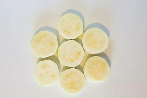 Zucchini sliced on white background Stock Photos