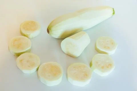 Zucchini sliced on white background Stock Photos