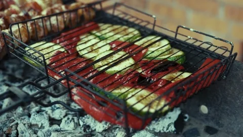 Zucchini slices and marinated meat baking on wood charcoal Video stock 343385515