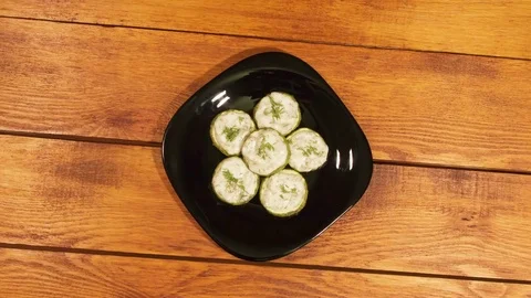 Zucchini snack with with garlic sauce, cooked in the oven. Stock Footage 74363136