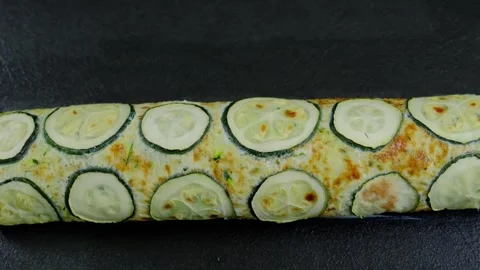 Zucchini Topped Baked Dish on Dark Surface Cooking Stock Footage 341435501