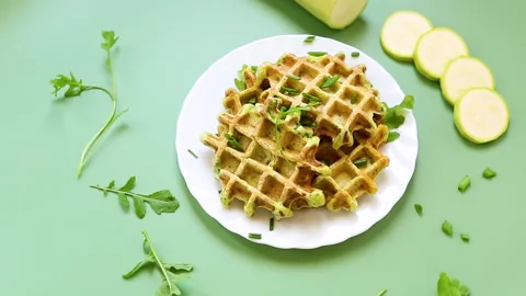 Zucchini waffles with greens isolated on a background Stock Footage 313216705