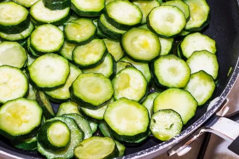 Zucchini while cooking Stock Photos