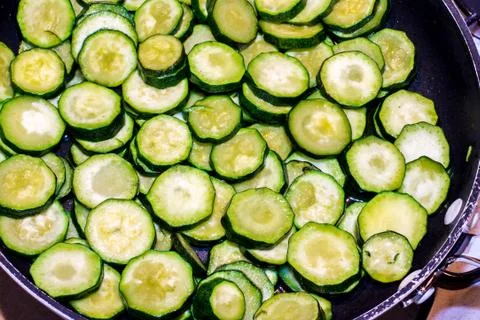 Zucchini while cooking Stock Photos