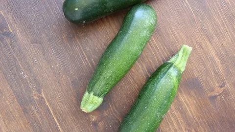 Zucchini on wood from above Stock Footage 94875297