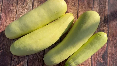 Zucchini on a wooden table Stock Footage 247857566
