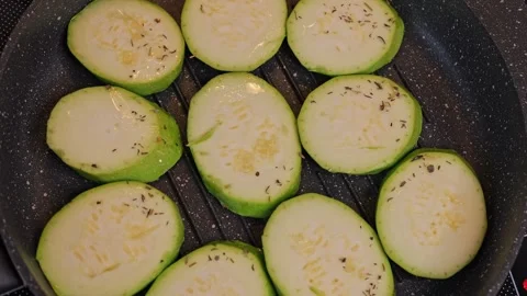 Zucchinis grill without oil, epitomizing healthy eating. Delight in the Stock Footage 264759060