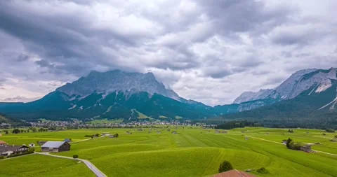 Zugspitze timelapse from Lermoos with fields and moving clouds Video stock 342949442