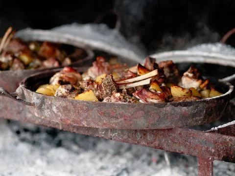 Zum zeri lamb cooked in a really big container called testo a tasty special.. Stock Photos
