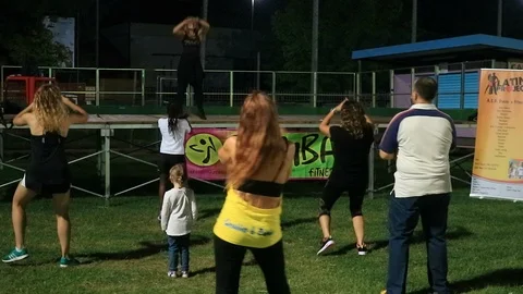 A zumba lesson on the lawn Stock Footage 105228192