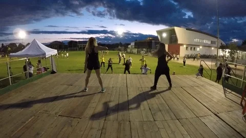 A zumba lesson on the lawn Stock Footage 105232983