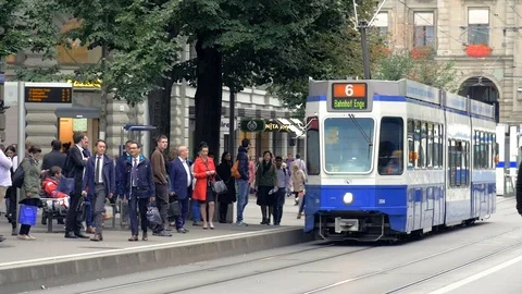 Zurich city traffic with tram and people walking Stock Footage