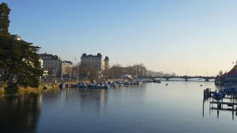 Zurich sunset river dock quaibrücke traffic bridge panorama 4k switzerland Stock Footage