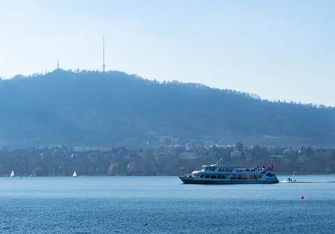 Zurich, Switzerland - March 5th 2022: A passenger boat cruising over lake Zurich Stock Photos