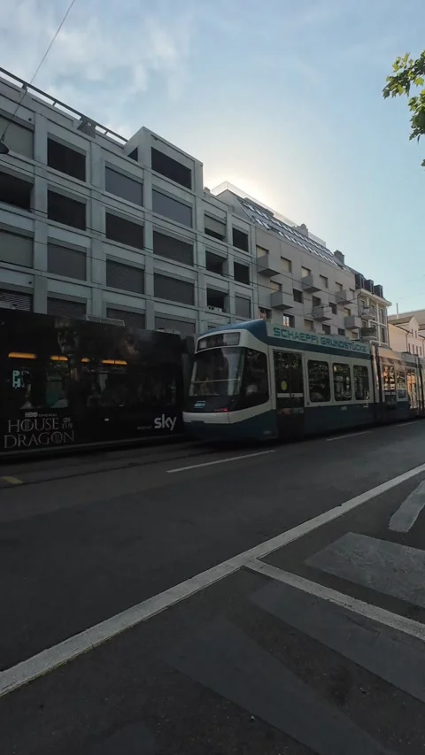 Zurich trams operating on city streets during a regular summer day Stock Footage 339353665