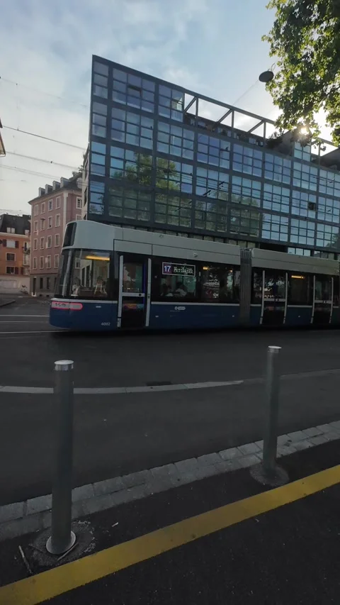 Zurich trams operating on city streets during a regular summer day Stock Footage 339353685