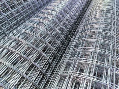 Zync plated wired mesh rolls close-up full frame background Stock Photos